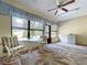 Relaxing sunroom with chairs, table, and natural light at 1600 Alma Ct, Bartow, FL 33830