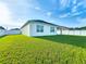 Expansive backyard with lush green grass and a white fence offers plenty of privacy at 1835 Jackson Oaks Dr, Bartow, FL 33830