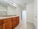 Bathroom with double vanity, tile flooring, and walk-in shower with glass door at 1835 Jackson Oaks Dr, Bartow, FL 33830
