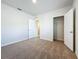 This bedroom features neutral carpet, closet, and white trim offering a clean aesthetic at 1835 Jackson Oaks Dr, Bartow, FL 33830