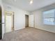 The spacious bedroom features a closet, natural light, and neutral carpeting at 1835 Jackson Oaks Dr, Bartow, FL 33830