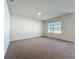 Bedroom featuring neutral carpet, white walls and window with horizontal blinds at 1835 Jackson Oaks Dr, Bartow, FL 33830