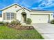 Charming single-story home features a well-manicured lawn and a two-car garage at 1835 Jackson Oaks Dr, Bartow, FL 33830