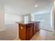 Open kitchen with island features a sink, dishwasher, and wood cabinets at 1835 Jackson Oaks Dr, Bartow, FL 33830