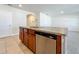 Kitchen island with sink, stainless steel dishwasher, and plenty of cabinet space at 1835 Jackson Oaks Dr, Bartow, FL 33830