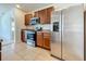 Kitchen features stainless steel appliances, granite countertops, and tile flooring at 1835 Jackson Oaks Dr, Bartow, FL 33830