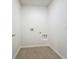 The laundry room is equipped with washer and dryer hookups and tile floors at 1835 Jackson Oaks Dr, Bartow, FL 33830