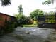 Spacious backyard showcases patio, landscaping and a tranquil screened enclosure at 1835 Mount Pisgah Rd, Fort Meade, FL 33841