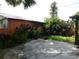 View of backyard featuring a serene patio area surrounded by lush greenery and shade at 1835 Mount Pisgah Rd, Fort Meade, FL 33841