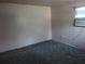 Simple bedroom featuring green carpet and window unit air conditioner at 1835 Mount Pisgah Rd, Fort Meade, FL 33841