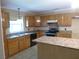 Kitchen with tile floors and wood cabinets at 1835 Mount Pisgah Rd, Fort Meade, FL 33841