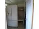 Pantry adjacent to the refrigerator features lots of storage space at 1835 Mount Pisgah Rd, Fort Meade, FL 33841