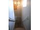 Stairwell with wooden steps and white railing leads to the upper level at 1835 Mount Pisgah Rd, Fort Meade, FL 33841