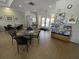 Community room with tables, chairs, and a bulletin board at 184 Ocean Bluff Dr, Poinciana, FL 34759