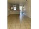 Open living room boasts tile floors and seamless flow to kitchen, perfect for entertaining at 184 Ocean Bluff Dr, Poinciana, FL 34759