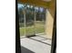 Screened in patio with a view of a manicured lawn at 184 Ocean Bluff Dr, Poinciana, FL 34759