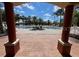 Community pool with palm trees and lounge chairs at 184 Ocean Bluff Dr, Poinciana, FL 34759
