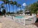 Community kiddie pool surrounded by lounge chairs and palm trees at 184 Ocean Bluff Dr, Poinciana, FL 34759