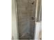 Modern bathroom shower features gray tile walls and a mosaic tile floor at 184 Ocean Bluff Dr, Poinciana, FL 34759