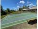 Community shuffleboard court with benches and a view of the surrounding homes at 184 Ocean Bluff Dr, Poinciana, FL 34759