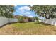 Large backyard with a privacy fence and a screened-in patio, perfect for outdoor gatherings at 1850 Saddlewood Pl, Bartow, FL 33830