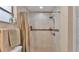Bathroom with tiled shower featuring a shower head and a built-in niche at 1850 Saddlewood Pl, Bartow, FL 33830