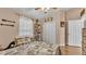 Comfortable bedroom with neutral tones, a ceiling fan, and closet space at 1850 Saddlewood Pl, Bartow, FL 33830