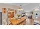 Dining area featuring wood table, decorative hutch, and open view to the living room at 1850 Saddlewood Pl, Bartow, FL 33830