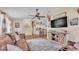 A spacious living room showcasing hardwood floors, leather couches, entertainment center, decor, and open floor plan at 1850 Saddlewood Pl, Bartow, FL 33830