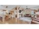 Inviting living room with an open concept design, hardwood floors, and comfortable leather furniture at 1850 Saddlewood Pl, Bartow, FL 33830