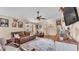 A cozy living room with hardwood floors, leather furniture, decor accents, and an open floor plan at 1850 Saddlewood Pl, Bartow, FL 33830