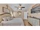 Spacious main bedroom with wood floors, ceiling fan, and a dresser at 1850 Saddlewood Pl, Bartow, FL 33830