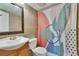Bathroom featuring stylish vanity, toilet, and shower with decorative curtain at 1920 E Edgewood Dr # D7, Lakeland, FL 33803