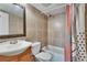 Tiled bathroom featuring a vanity, toilet, and shower with tub at 1920 E Edgewood Dr # D7, Lakeland, FL 33803