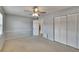 Bedroom with carpet, bi-fold closet doors, and neutral walls at 1920 E Edgewood Dr # D7, Lakeland, FL 33803