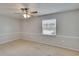Neutral bedroom featuring a window with natural light at 1920 E Edgewood Dr # D7, Lakeland, FL 33803