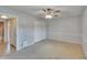 View of bedroom showing adjacent bathroom and bi-fold door closet at 1920 E Edgewood Dr # D7, Lakeland, FL 33803
