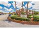 Welcome to Lake Bentley Shores Condominiums, featuring lush landscaping and mature trees at 1920 E Edgewood Dr # D7, Lakeland, FL 33803