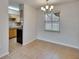 Bright dining area featuring neutral walls and tile flooring, perfect for casual meals or entertaining at 1920 E Edgewood Dr # D7, Lakeland, FL 33803