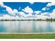 Scenic lake view showcasing the expansive water and clear blue sky, with trees lining the horizon at 1920 E Edgewood Dr # D7, Lakeland, FL 33803
