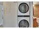 Convenient laundry area includes stackable washer/dryer and close proximity to bathroom at 1920 E Edgewood Dr # D7, Lakeland, FL 33803