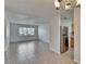 Bright living room with tile flooring and a view into the kitchen, creating an open and connected space at 1920 E Edgewood Dr # D7, Lakeland, FL 33803