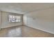Open living area with tiled flooring, a window bringing in natural light, and a neutral color palette at 1920 E Edgewood Dr # D7, Lakeland, FL 33803