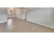 Bright living room features neutral walls, tile flooring, and a window with blinds at 1920 E Edgewood Dr # D7, Lakeland, FL 33803
