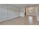 Inviting living room showcasing neutral walls, tile flooring, and natural light at 1920 E Edgewood Dr # D7, Lakeland, FL 33803