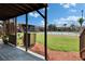 Outdoor space with views of a tennis court and landscaped community at 1920 E Edgewood Dr # D7, Lakeland, FL 33803