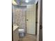 Full bathroom with a toilet and coral-themed shower curtain at 2055 S Floral Ave # 262, Bartow, FL 33830