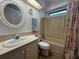 Bathroom featuring a toilet, sink, vanity, and a tub with a shower at 2055 S Floral Ave # 262, Bartow, FL 33830