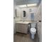 Bathroom features a toilet, sink with vanity, and towel rack at 2055 S Floral Ave # 262, Bartow, FL 33830