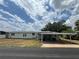 Charming single-story home with a covered carport and well-maintained lawn at 2055 S Floral Ave # 262, Bartow, FL 33830